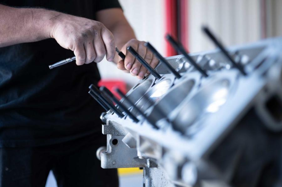 Engine block being assembled by hand