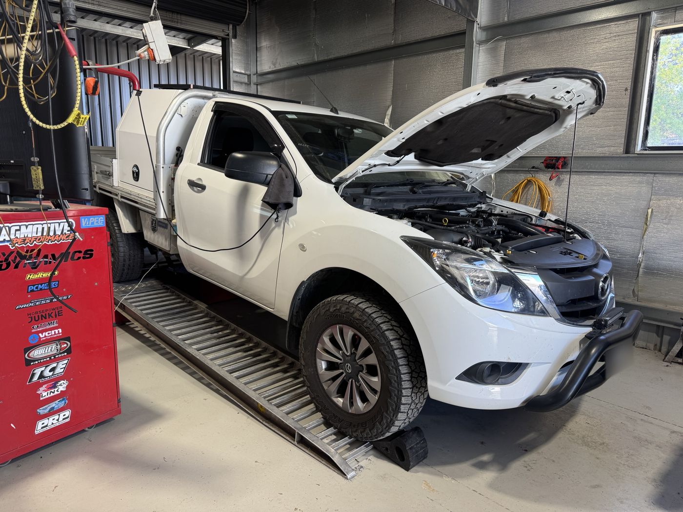 White Mazda BT-50 ute on the Jagmotive dyno with its bonnet up