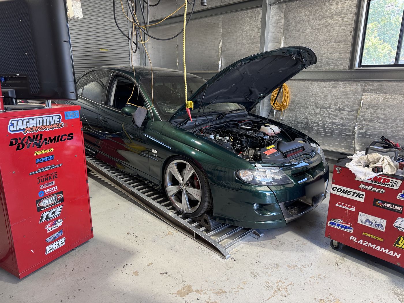 Green HSV VX II Clubsport on the Jagmotive dyno with its bonnet up