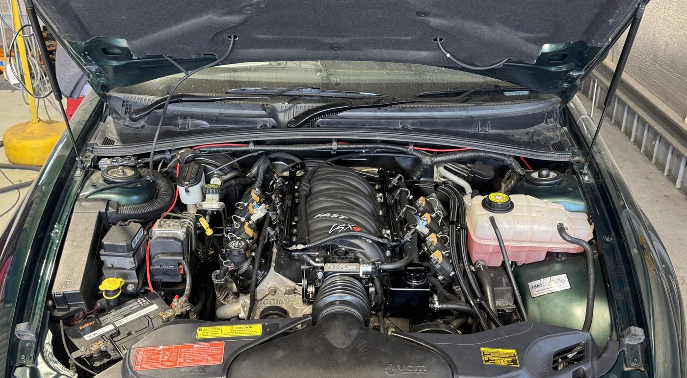Rebuilt 383 stroker LS V8 with a FAST intake manifold in the engine bay of an HSV VX II Clubsport