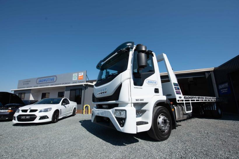 The Jagmotive tilt-tray tow truck outside the workshop
